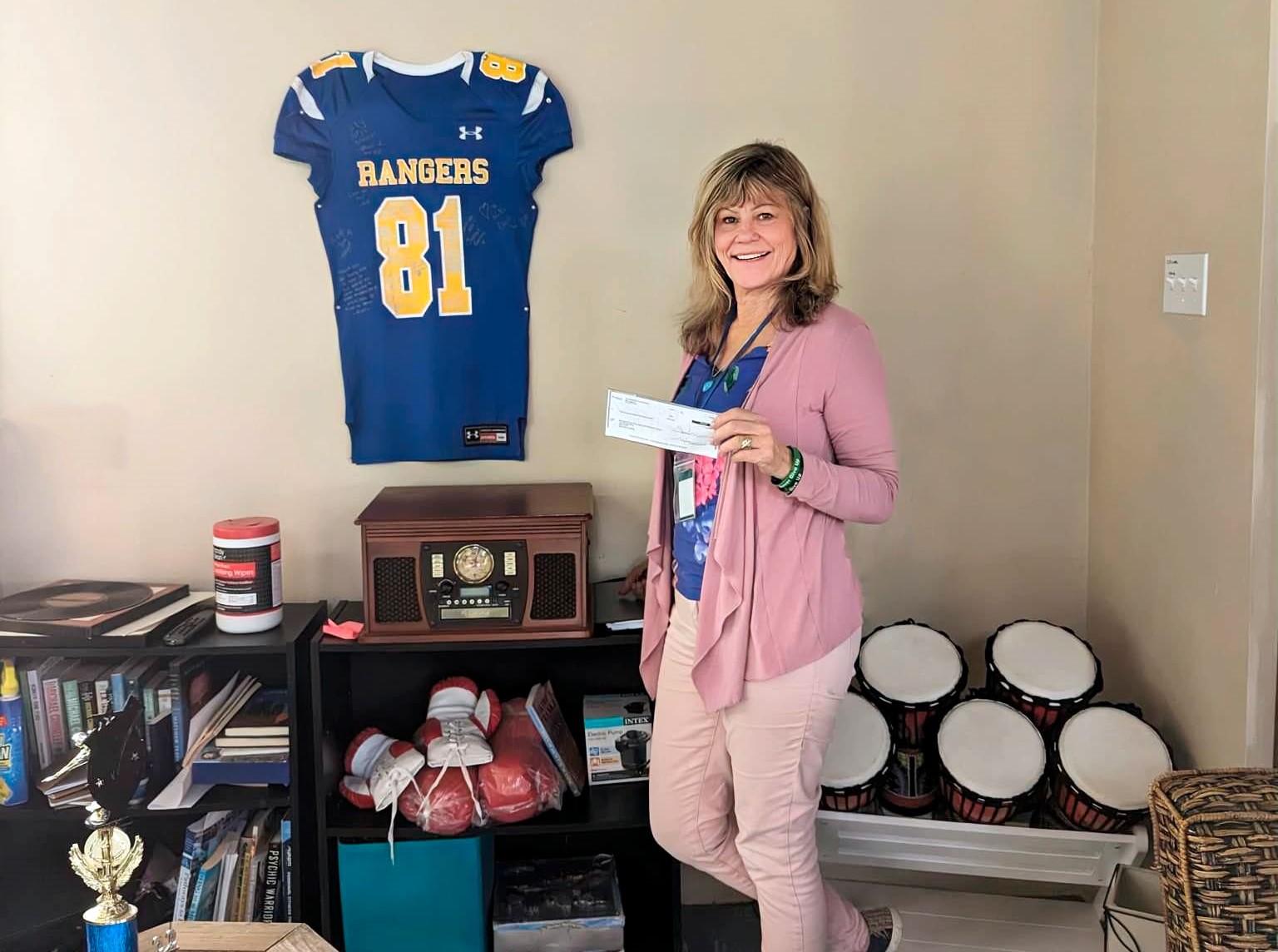 Heidi holding the check